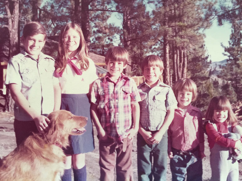 Kirsch siblings outside with family dog.